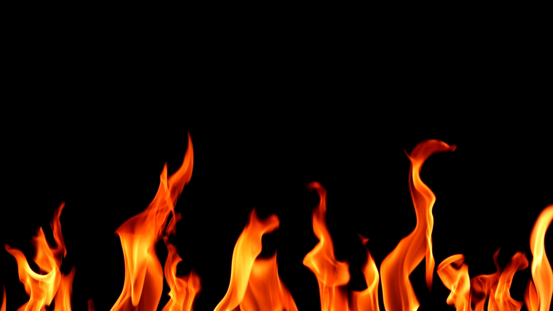 A fire is burning in the dark.